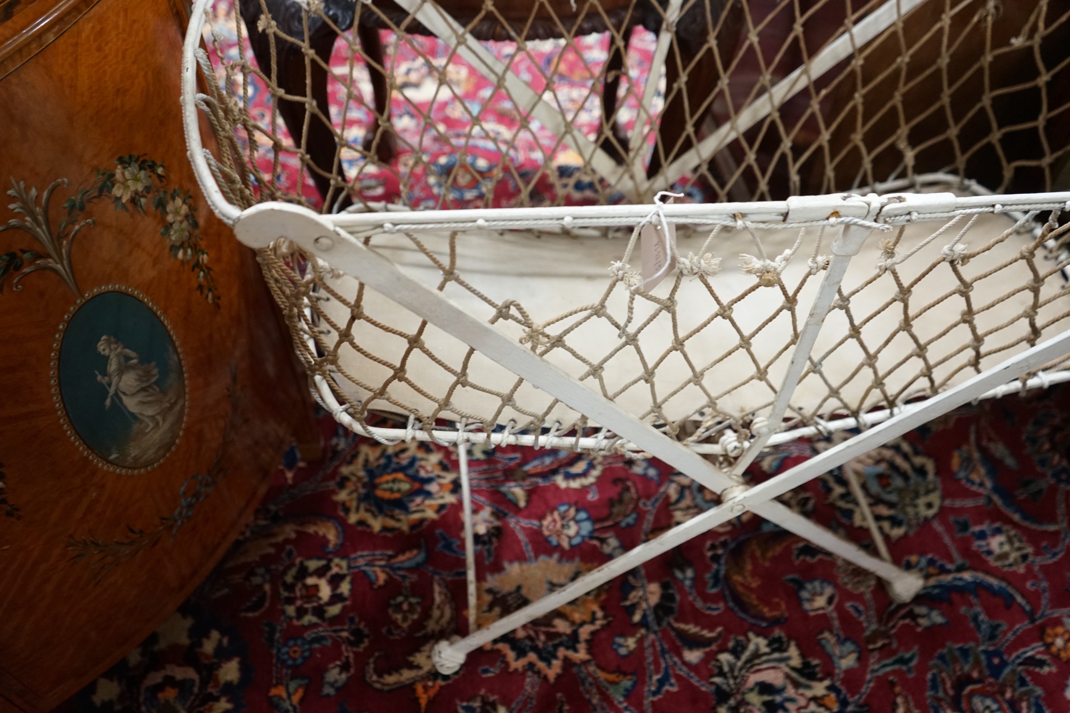 A Victorian metal folding crib, length 90cm, depth 43cm, height 134cm